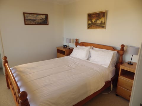 Queen bed with 2 single mattresses available for the living area.