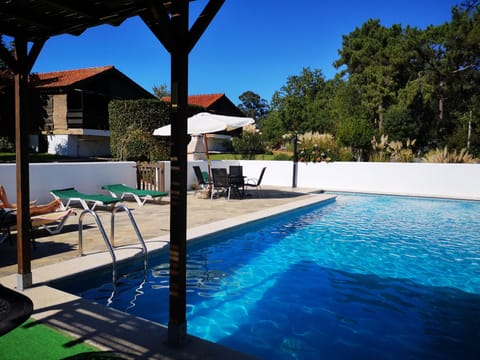 Large pool with Lodges in background