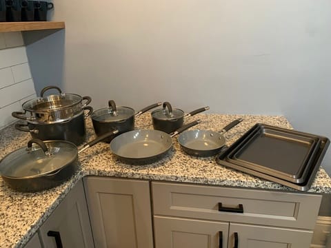 Kitchen is well appointed with cookware