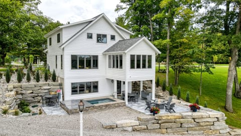 Lakeside of the house. Private Hot Tub, Outdoor Shower, Gas Grill and Fire pit.