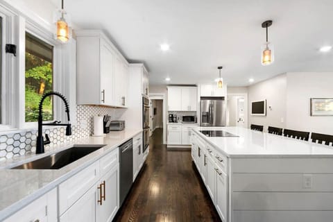 Large open kitchen with double ovens, induction cooktop, Ninja Blender, Toaster, Coffee pot & K-cup machine, crockpot and toaster