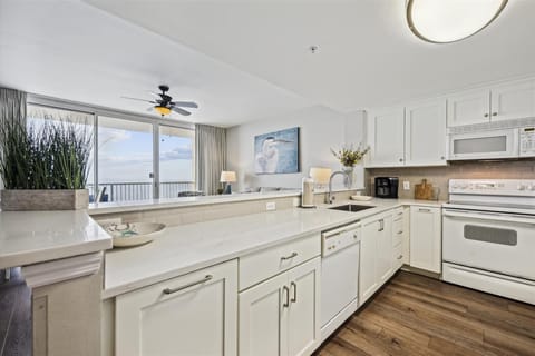 Fully Stocked Kitchen with Bar Seating