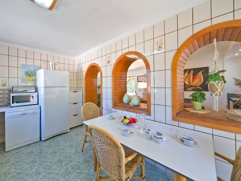 Furniture, Cabinetry, Building, Table, Orange, Interior Design, Wood, Chair, Floor, Kitchen