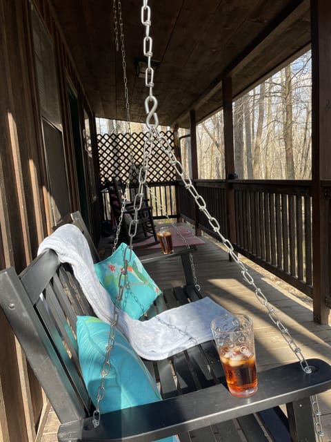 Spacious covered porch for relaxing, even on a rainy day.