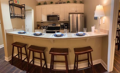 All new stainless steel appliances and 4-person bar seating.