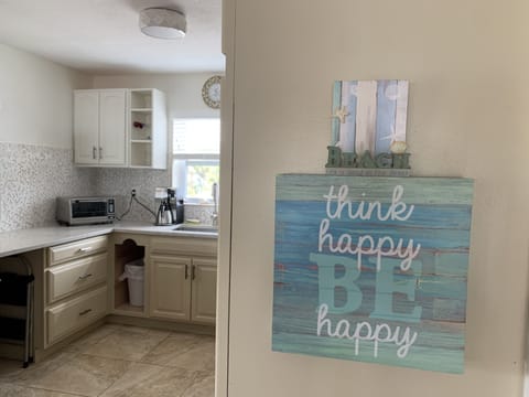 kitchen area well equipped with thermal coffee maker and toaster oven