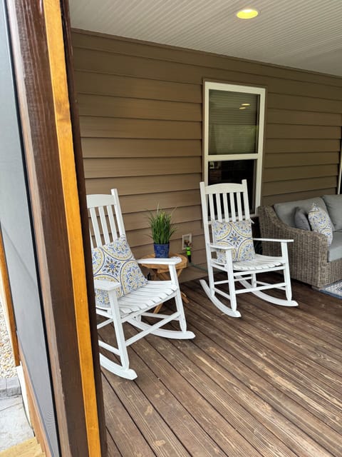 The screened in porch is a perfect place to relax and drink a cup of coffee.