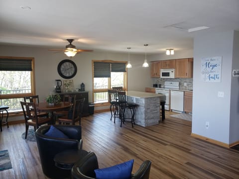 kitchen table kitchen island and fireplace overlooking the lake