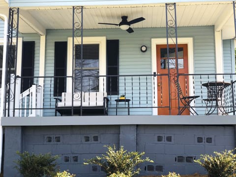 Enjoy a glass of wine or morning coffee on the pretty, comfortable front porch