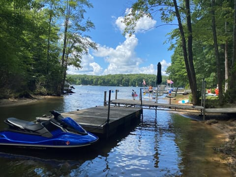 Summer view of our boat dock on the property (jetski not included in rental)