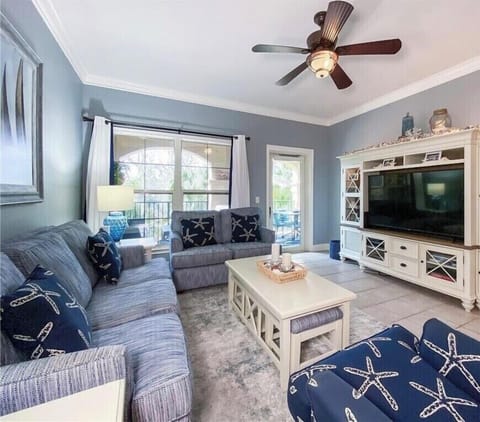 Spacious living room with seating for six an Smart 65" TV with Cable.