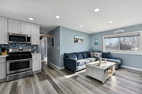 Inside view with back to #2 bathroom showing living room/kitchen/hallway