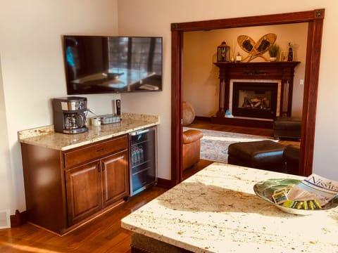 Enjoy fresh coffee while the gas fire burns or cold drinks when tanning on deck.