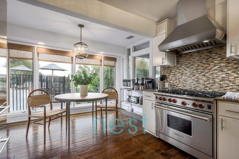KITCHEN | Breakfast table with Coffee Station to the right of it, 2 Drip Coffee Machines and 1 Keurig, blender, toaster, etc