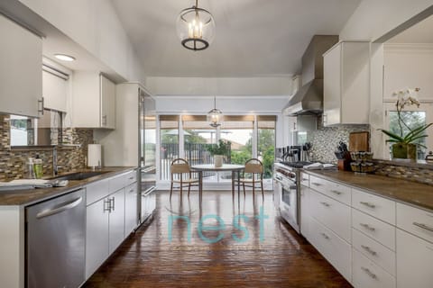 KITCHEN | view of windows overlooking pool & downtown views.