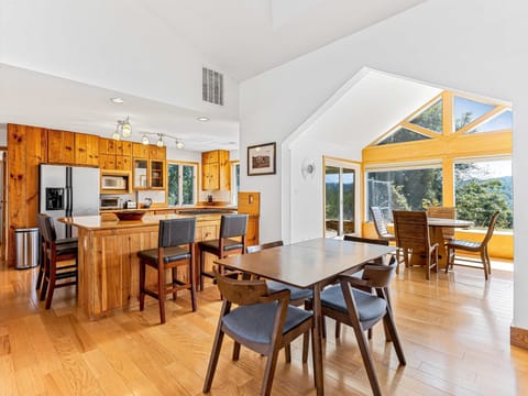 Open kitchen & dining. Sky lights, vaulted ceiling, windows & views!