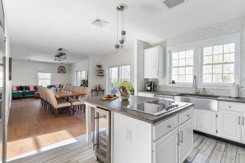 Open concept kitchen/dining with direct access to the pool 