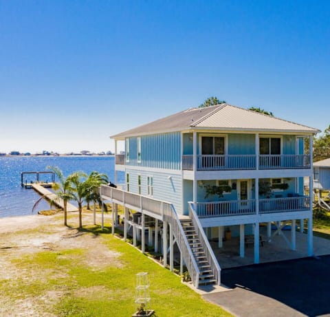 Front of home with view of private pier