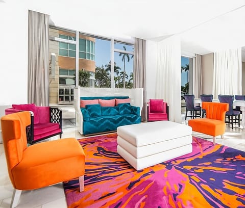 Unwind in vibrant lounge seating with sunlit, airy views.