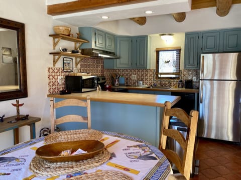 The kitchen is fully equipped with everything a cook needs.