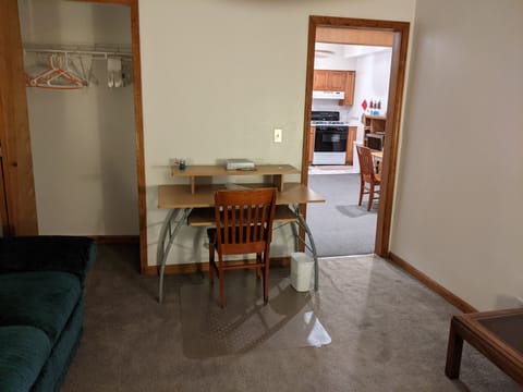 Work station in living room with lighted keyboard tray