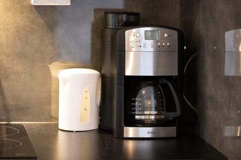 Coffee and tea facilities, including a kettle and coffee machine, ready for your morning rituals.