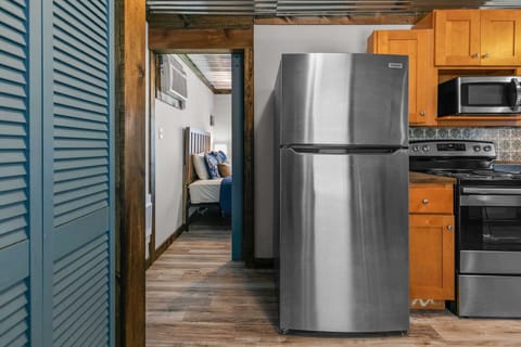 The primary bedroom is located just off the kitchen and is very private.