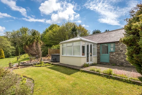 Have a soak in your own private hot tub is just to the left of the conservatory.