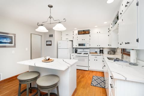 Updated kitchen with new quartz countertops and fully stocked w supplies to cook