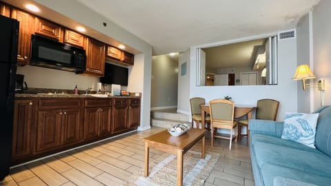 Kitchen: refrigerator with ice maker, stovetop, microwave, sink