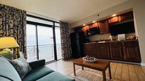 Kitchen: refrigerator with ice maker, stovetop, microwave, sink