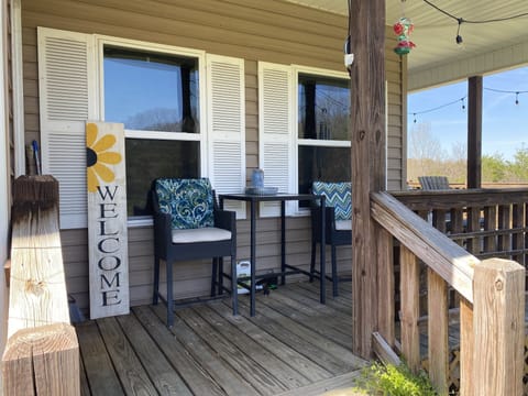 Front porch entrance. Three stairs to enter