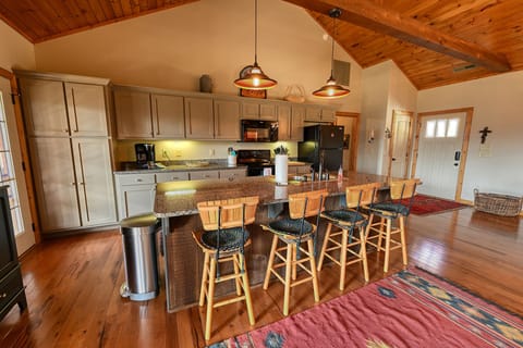 Kitchen with center island and barstool seating