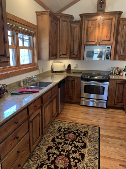 Fully equipped warm and neat kitchen for meals or enjoying coffee on the bar.