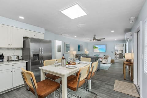 Unit 2:Open concept kitchen and living room. The  door to the adjoining apartment will be locked if you have booked one unit separately. If you have booked both units, the door can be open or closed as you wish.