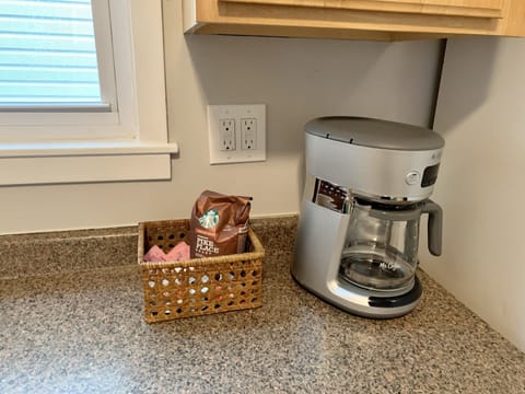 Brand new coffee maker and we have all the fixings for coffee or tea.