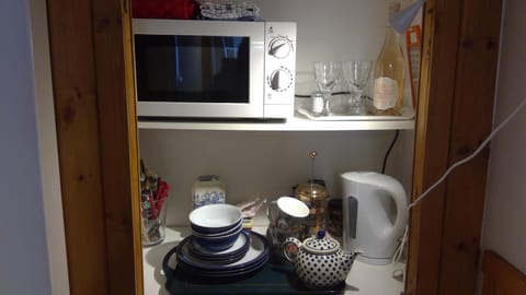 Micro kitchen with utensils. 