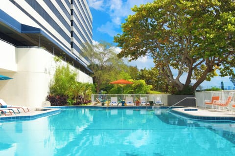 Soak up sunshine beside the sparkling pool and loungers.