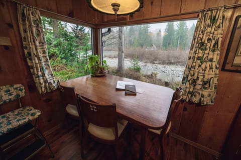 Kitchen table overlooking the river with an ideal view of Mt Baring