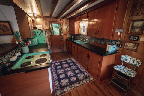 The kitchen, refurbished to match the year the cabin was built, 1959