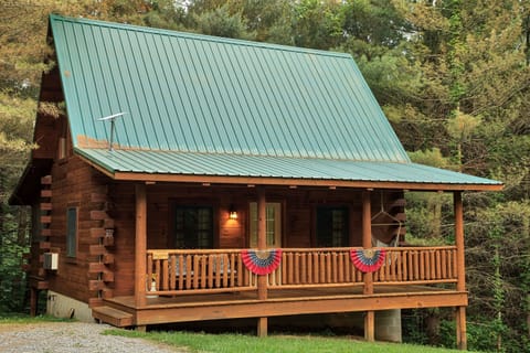 Dogwood Cabin offers a delightful, private retreat where beauty and peace abound, and couples can unwind under the trees,
