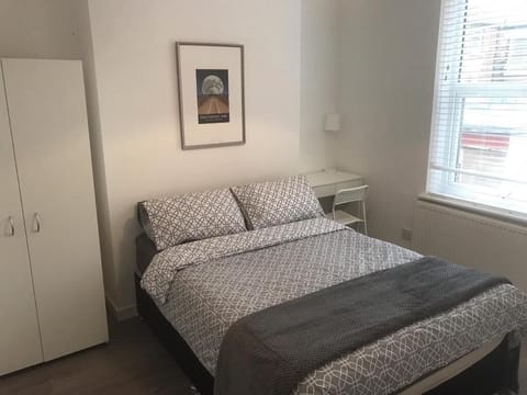 Bedroom 1. Double bedroom with desk/mirror.