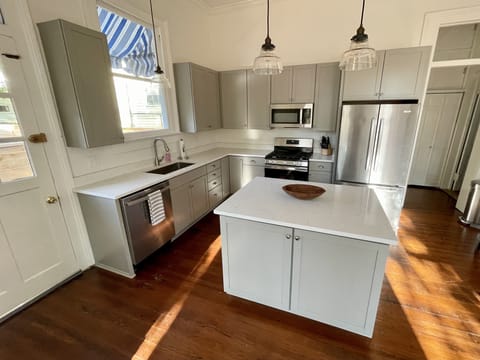 Quartz tops the kitchen island.
