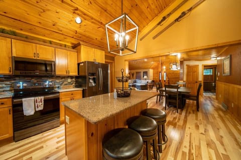 The kitchen island can seat 4 where the dining table can seat 6.