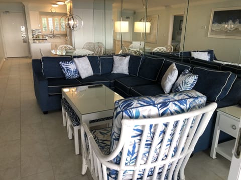Living area with pull out bed, which sleeps two. Padded stools beneath table.