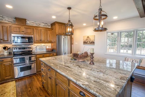 Large Kitchen with Granite Countertops and Bartop Seating