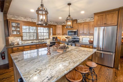 Large Kitchen with Granite Countertops and Bartop Seating