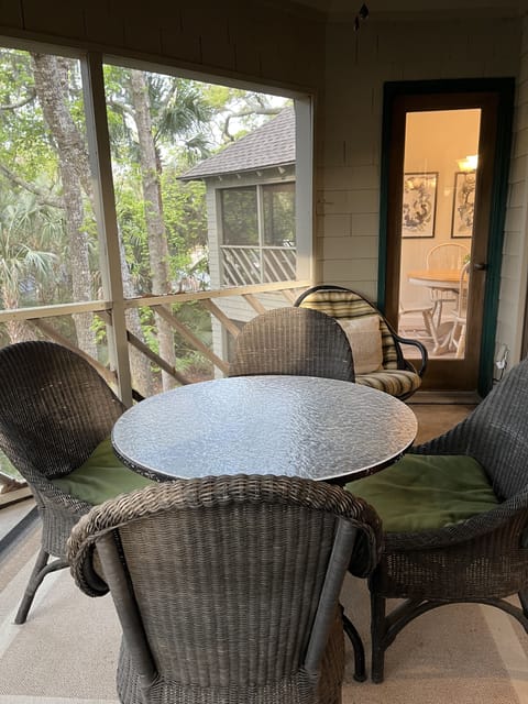 Outdoor dining on private screen porch 