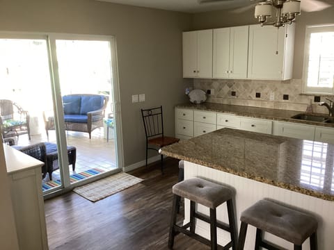 Patio door leading from kitchen to back porch area.