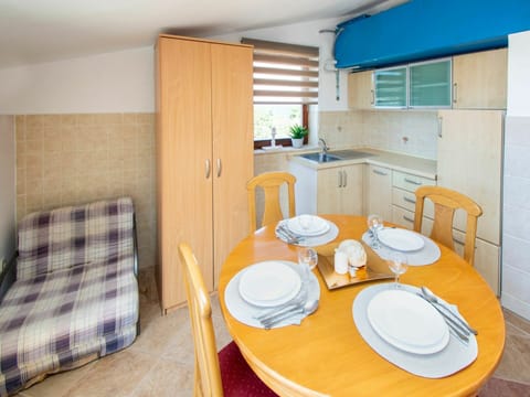 Furniture, Table, Property, Building, Dishware, Blue, Cabinetry, Wood, Interior Design, Chair